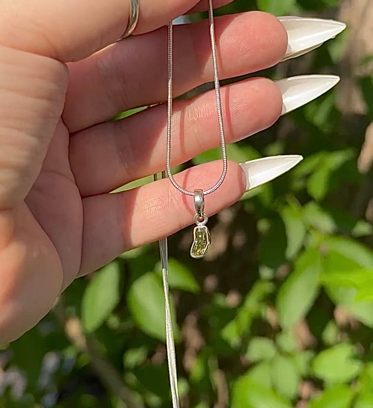 Sterling Silver Moldavite necklace.