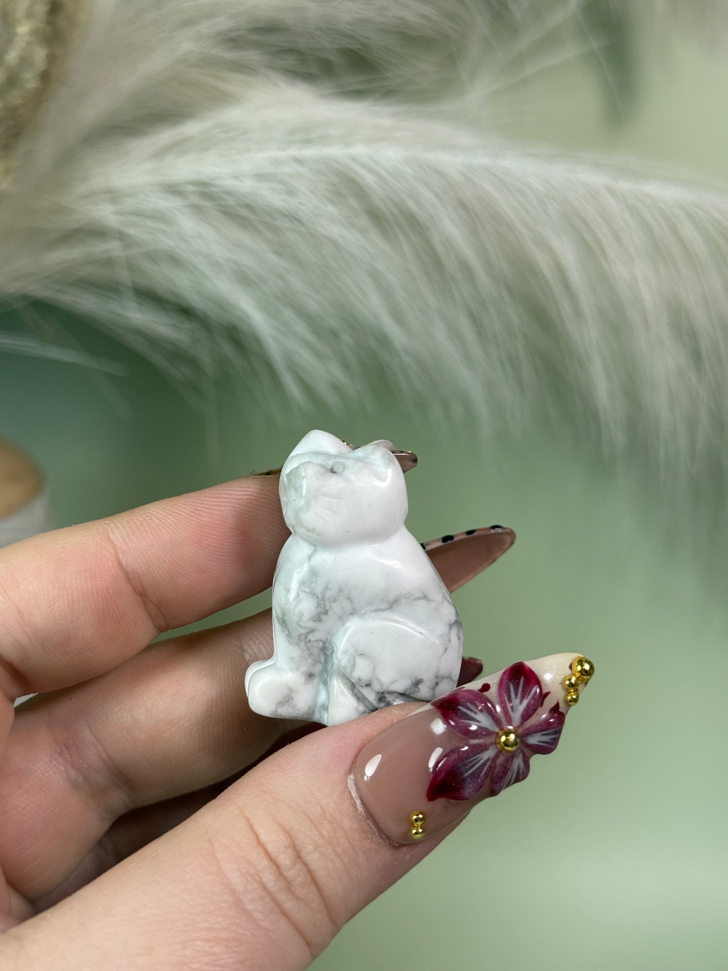 Crystal cat carvings.