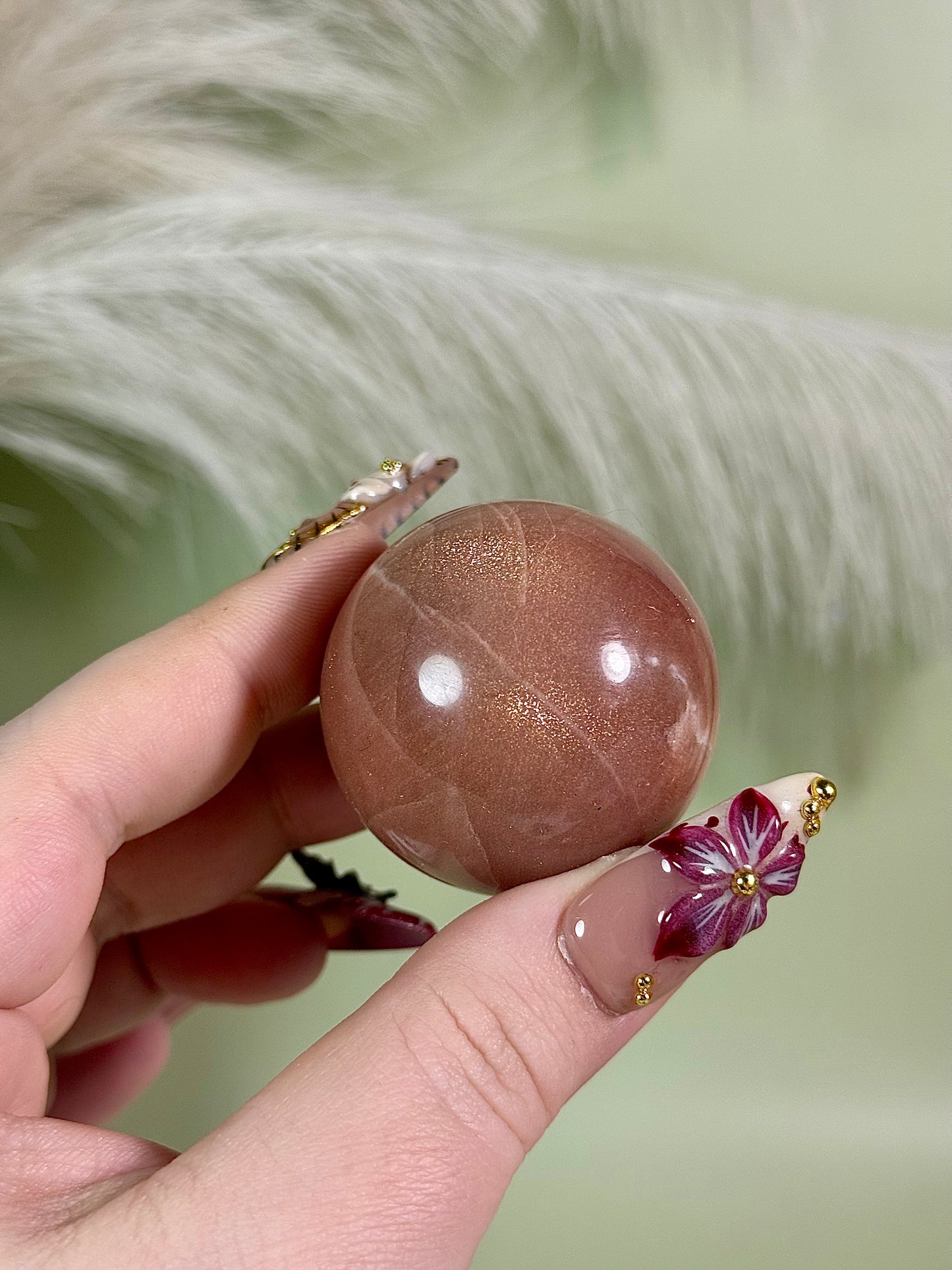 High quality peach moonstone sphere.