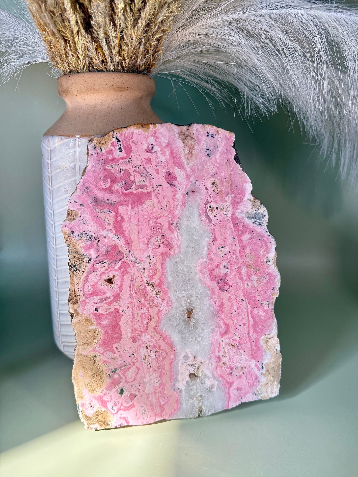 Bubblegum pink Rhodonite slab with Quartz center.