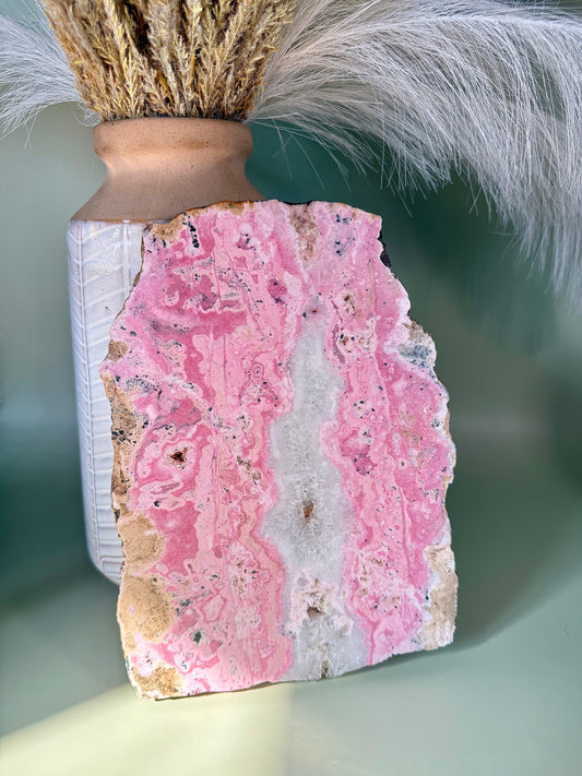 Bubblegum pink Rhodonite slab with Quartz center.