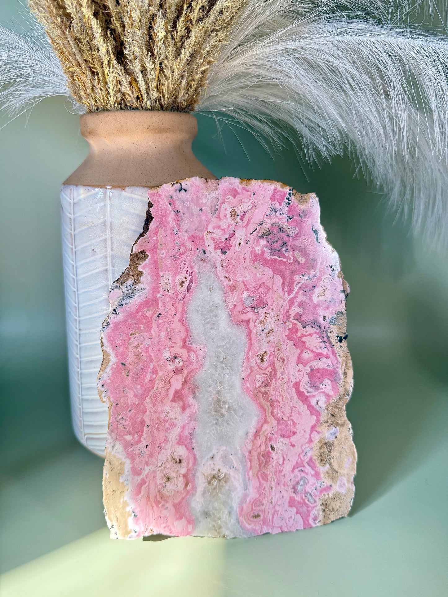 Bubblegum pink Rhodonite slab with Quartz center.