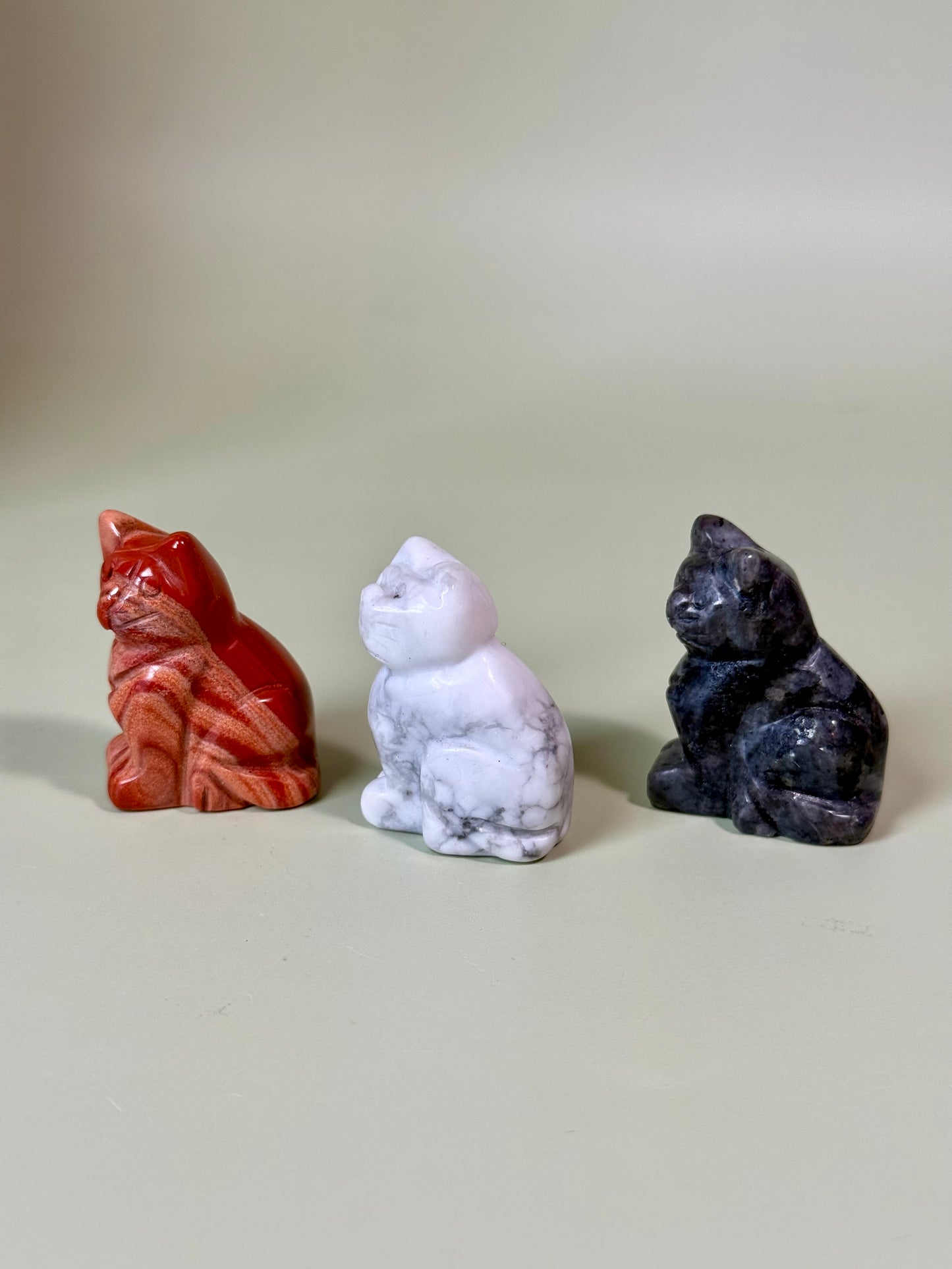 Crystal cat carvings.