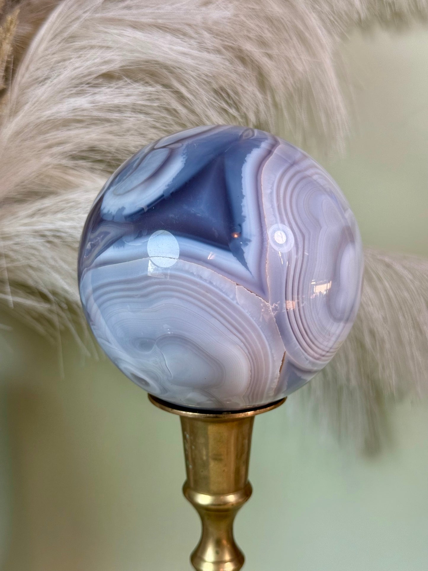 Banded Agate sphere. Repaired.