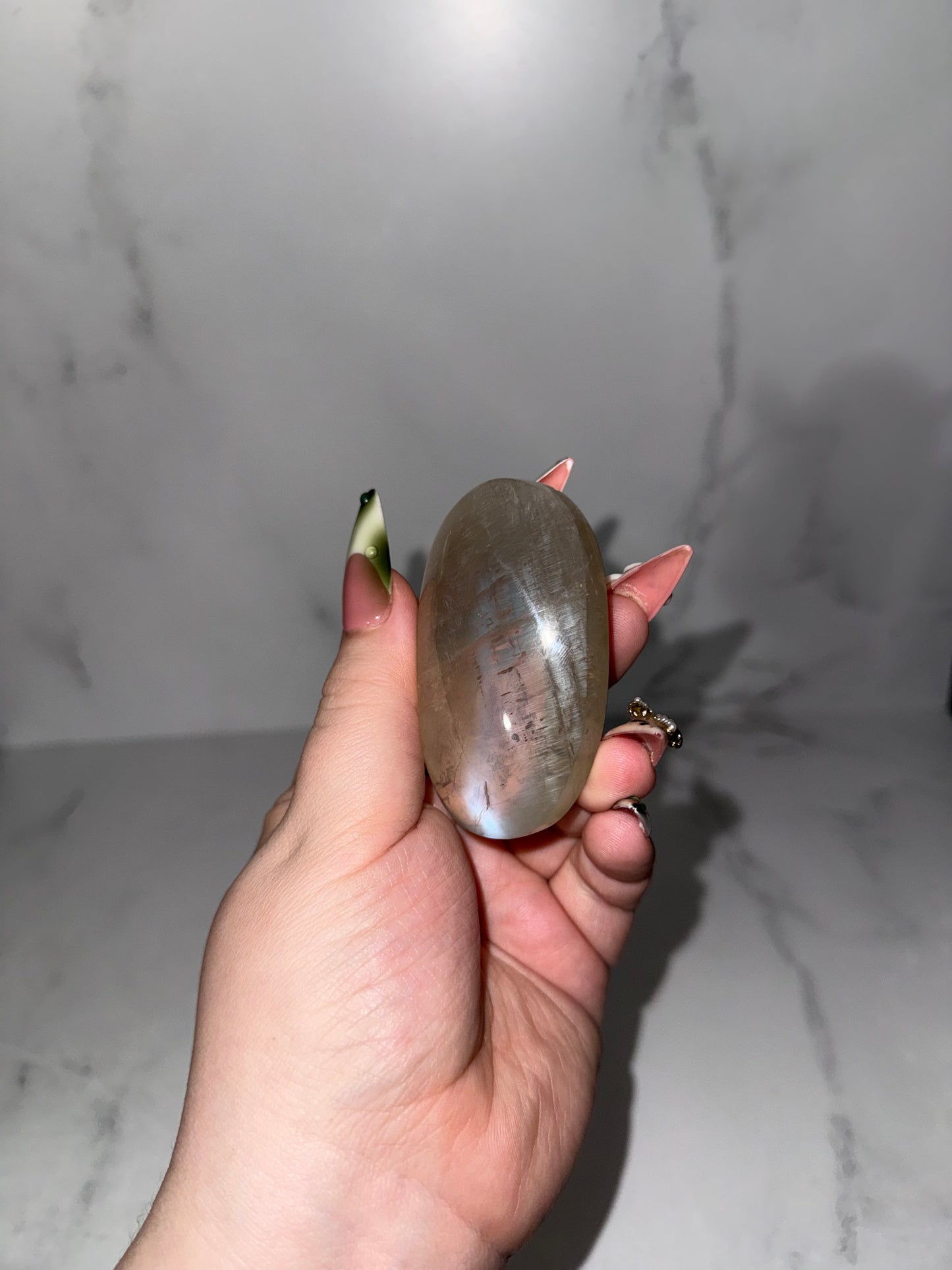 Large Gem Sage moonstone with blue flash palm. (Rare.)