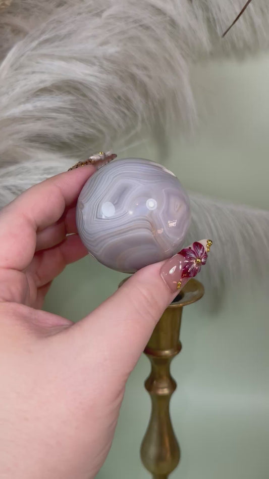 Banded agate sphere.