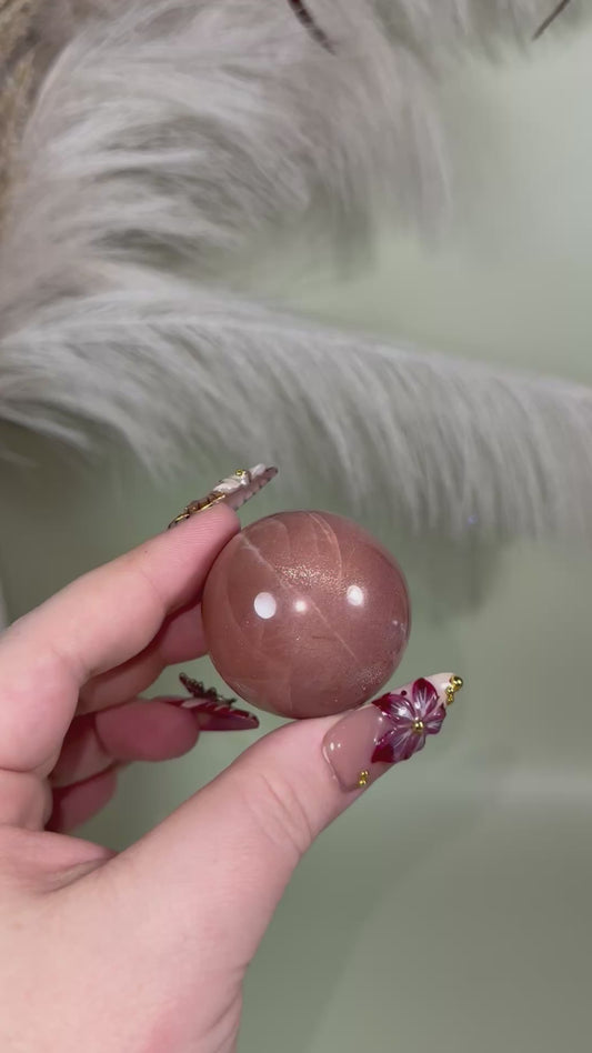 High quality peach moonstone sphere.