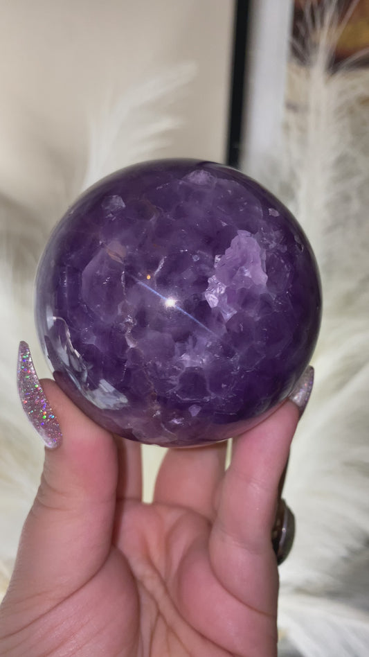 Pink Lace Agate sphere with Amethyst from Mexico.
